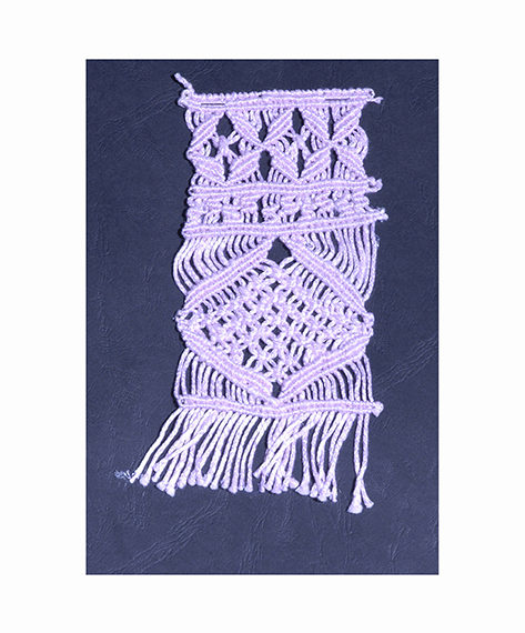 Cotton macramè plaited by hand on a loom