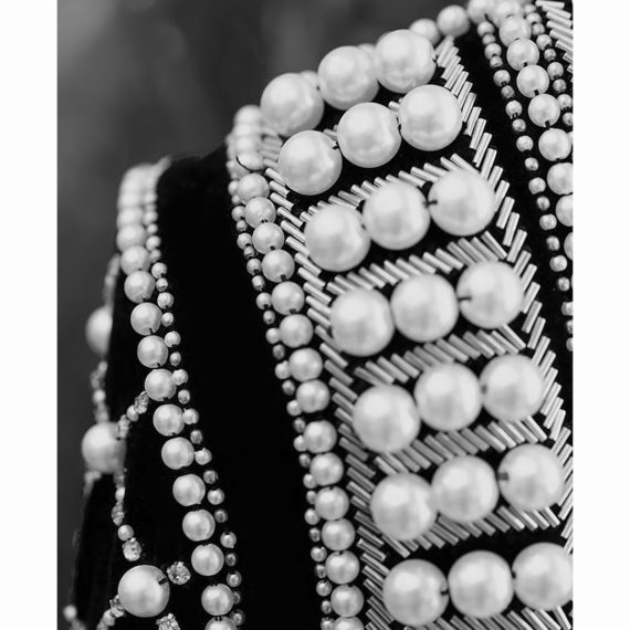 Hand seam of pearls, beads and tubes