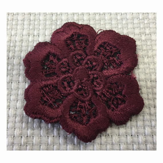 Embroidered macramè effect flower made with a contour cutting technique plus a 3D effect