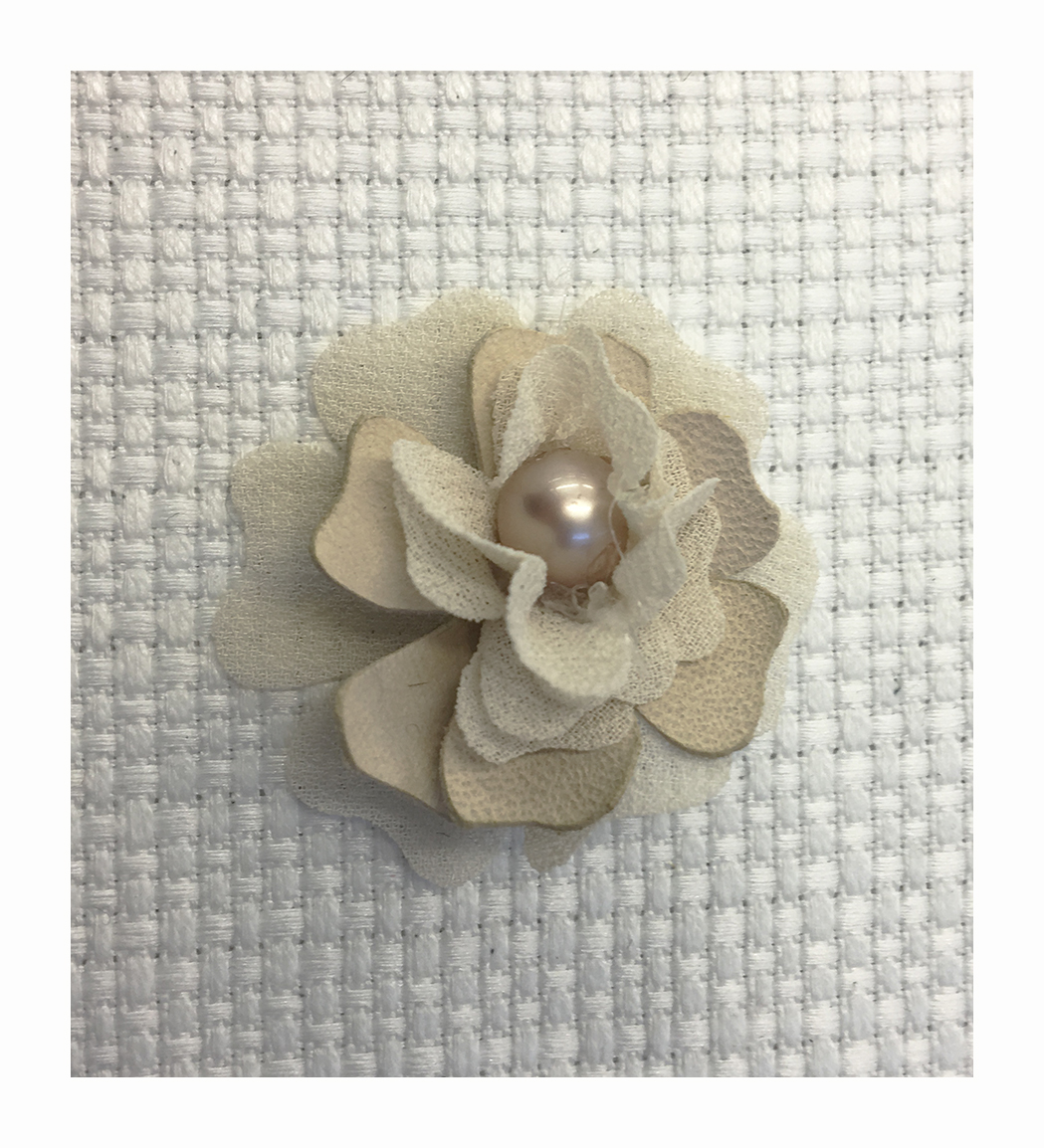 Flower made with georgette and cady petals laser treated and with a central pearl
