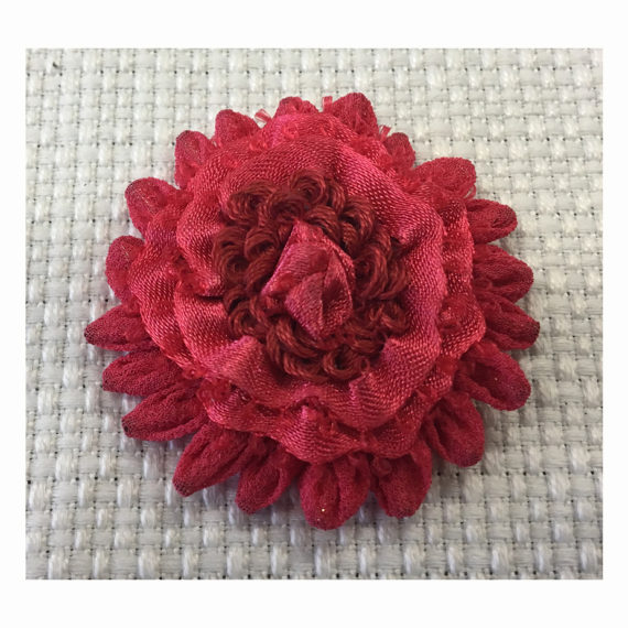 Hand- sewn flower made with different techniques